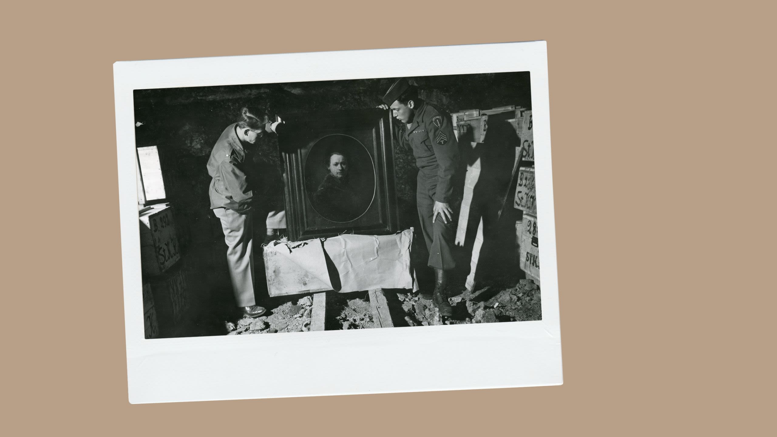 Two men looking at a painting (National Archives)