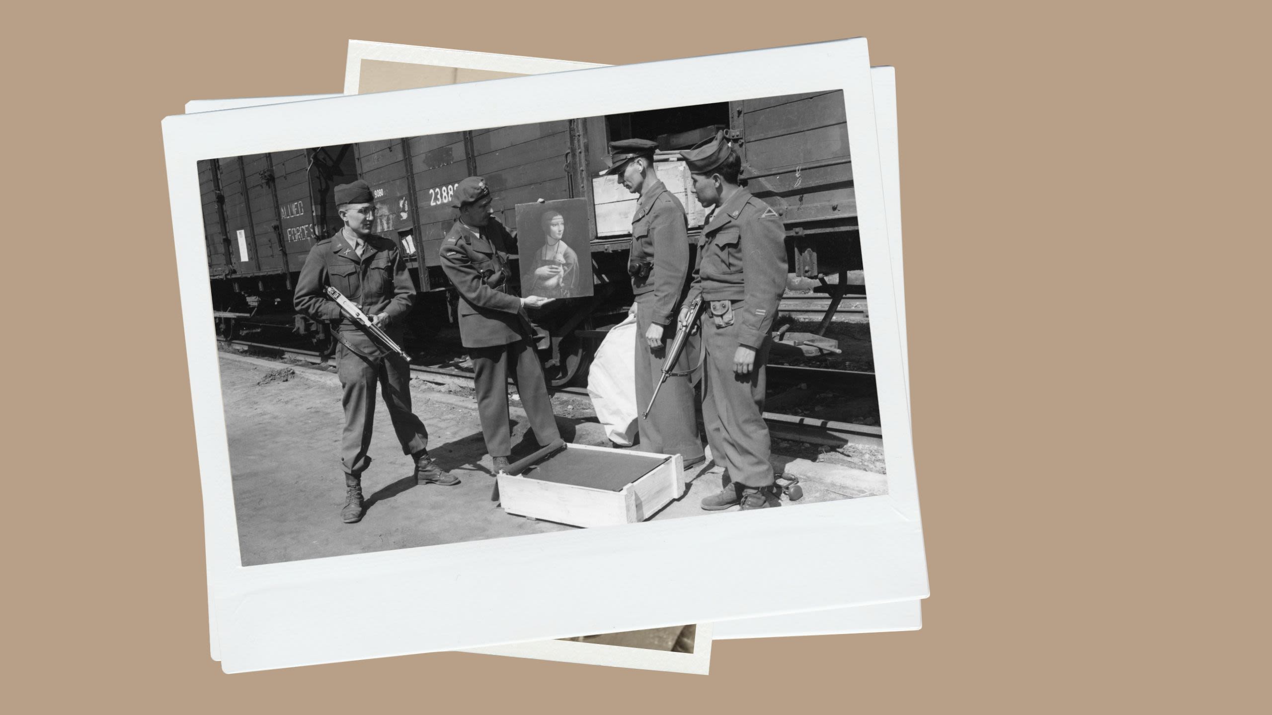 U.S. soldiers admire a painting (National Archives)