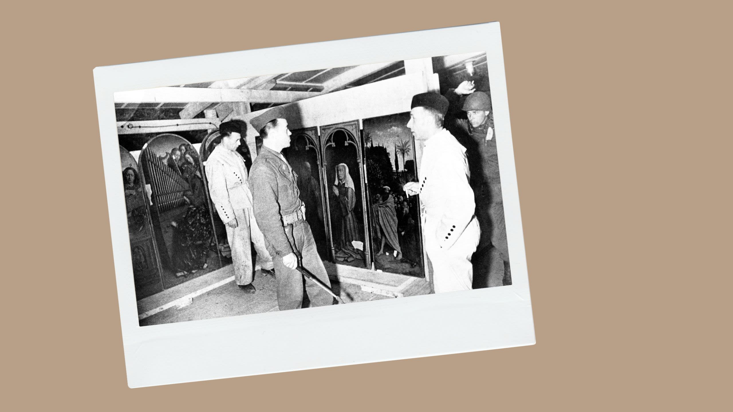 Soldiers examining Jan van Eyck’s Ghent Altarpiece in 1945. (© Pictures from History/Universal Images Group/Getty Images) 