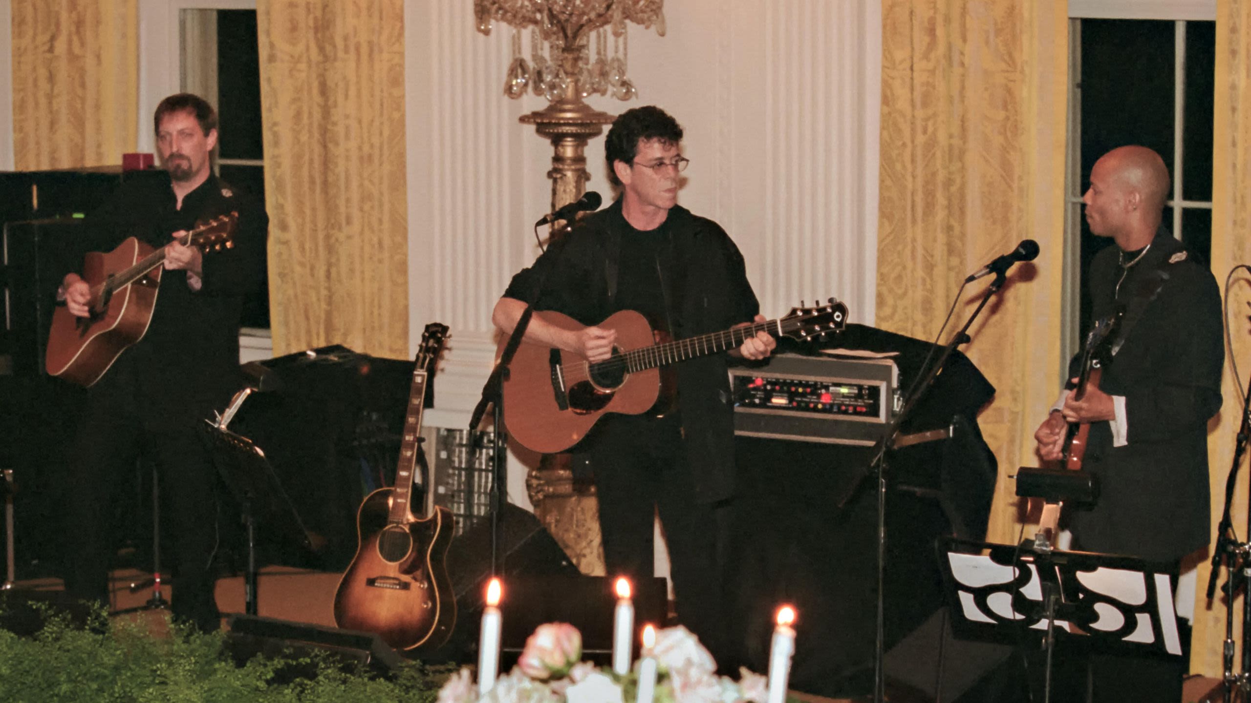 Lou Reed and band performing on stage (© Richard Ellis/Alamy)