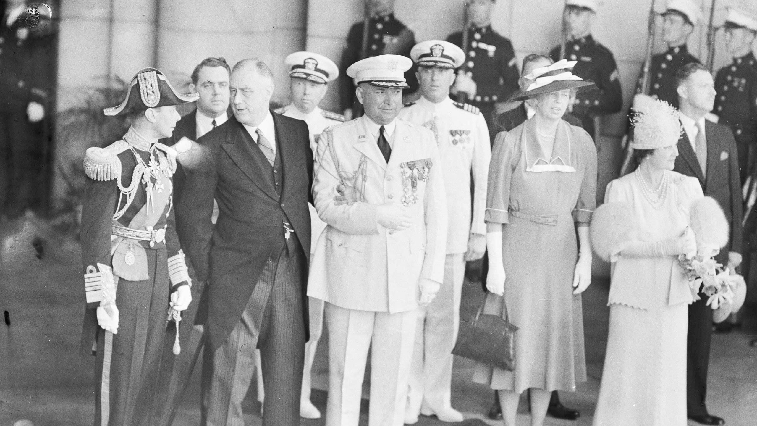 King George VI, Franklin Roosevelt, Eleanor Roosevelt, Queen Elizabeth and others attending a ceremony (© AP)
