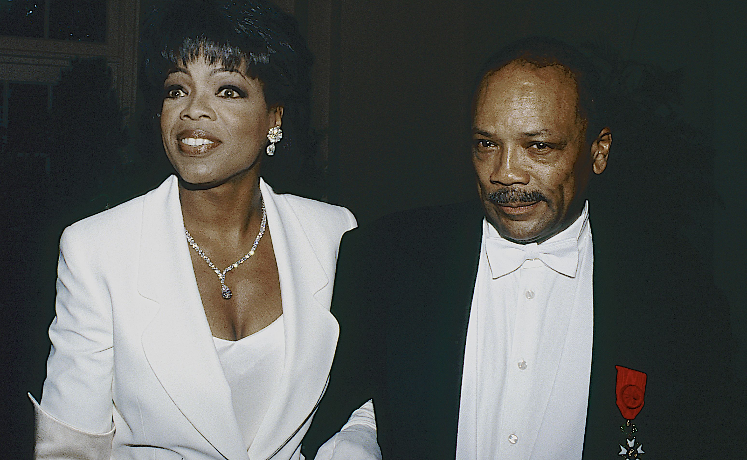 Oprah Winfrey, Quincy Jones arriving at event (© Mark Reinstein/Corbis/Getty Images)