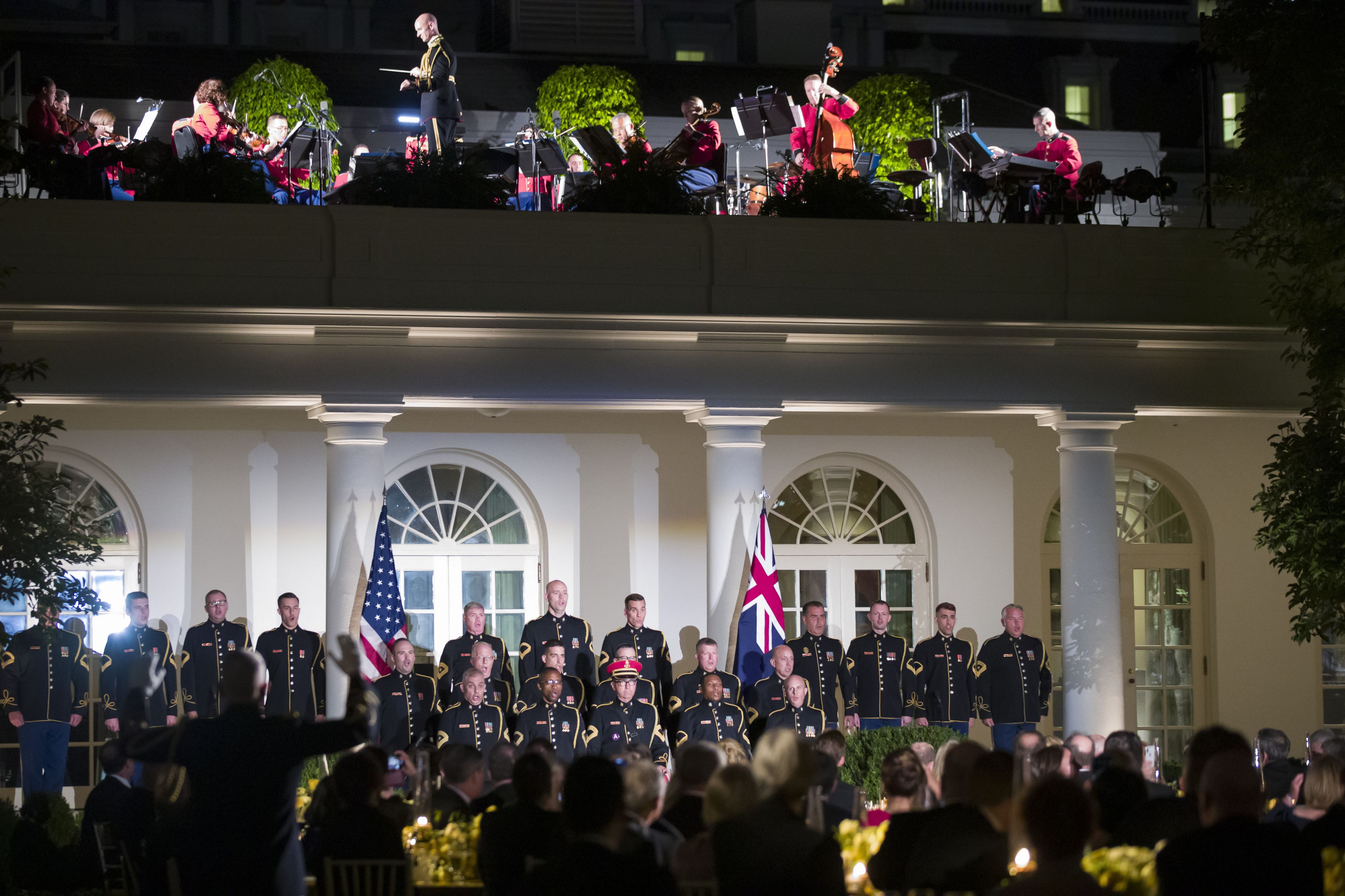 Band performing on the roof of the White House with a crowd below (© Alex Brandon/AP)
