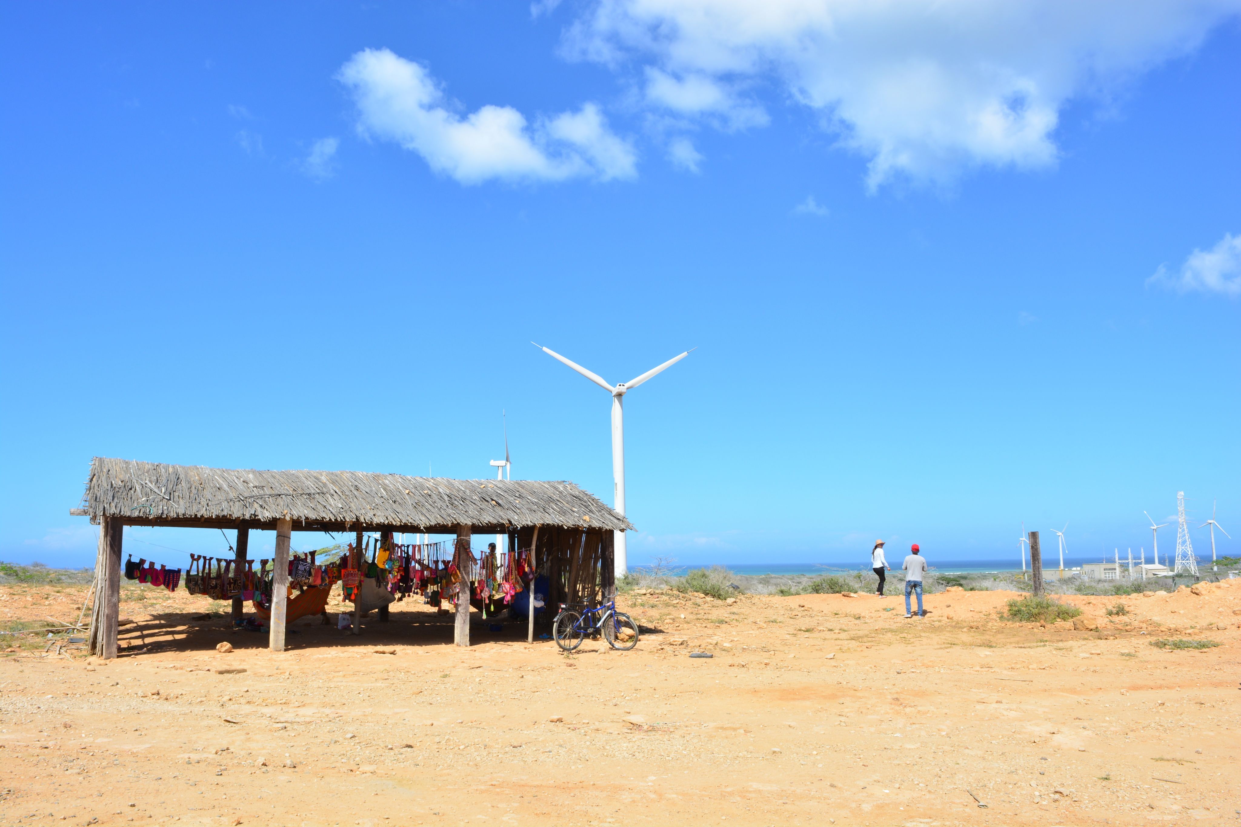 Handcrafts store of the wayuu indian tribe under wind turbines in La Guajira, Colombia.