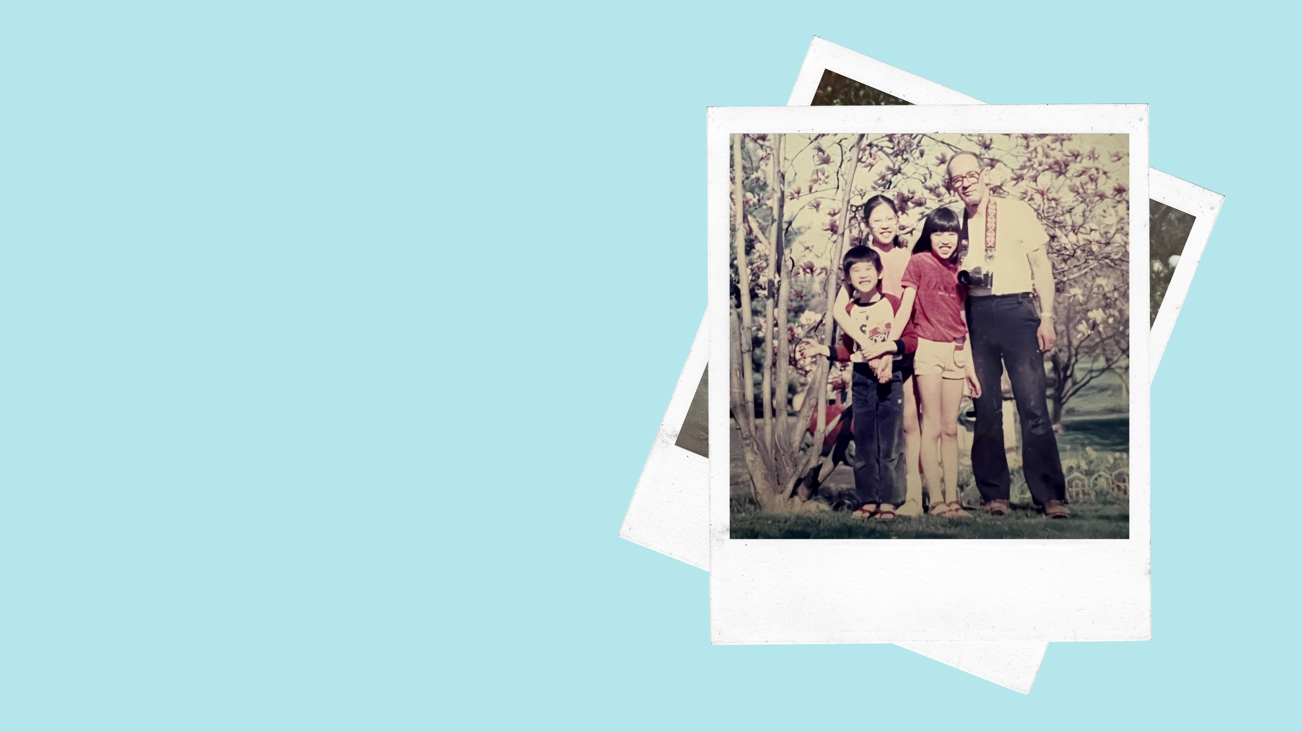 three children and an adult male smile for a group photo