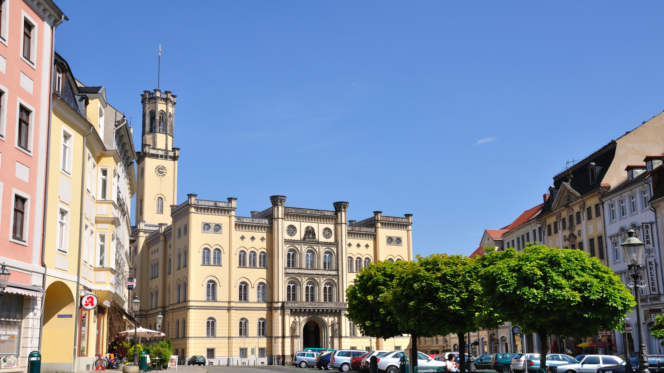 A European city street with cars and buildings