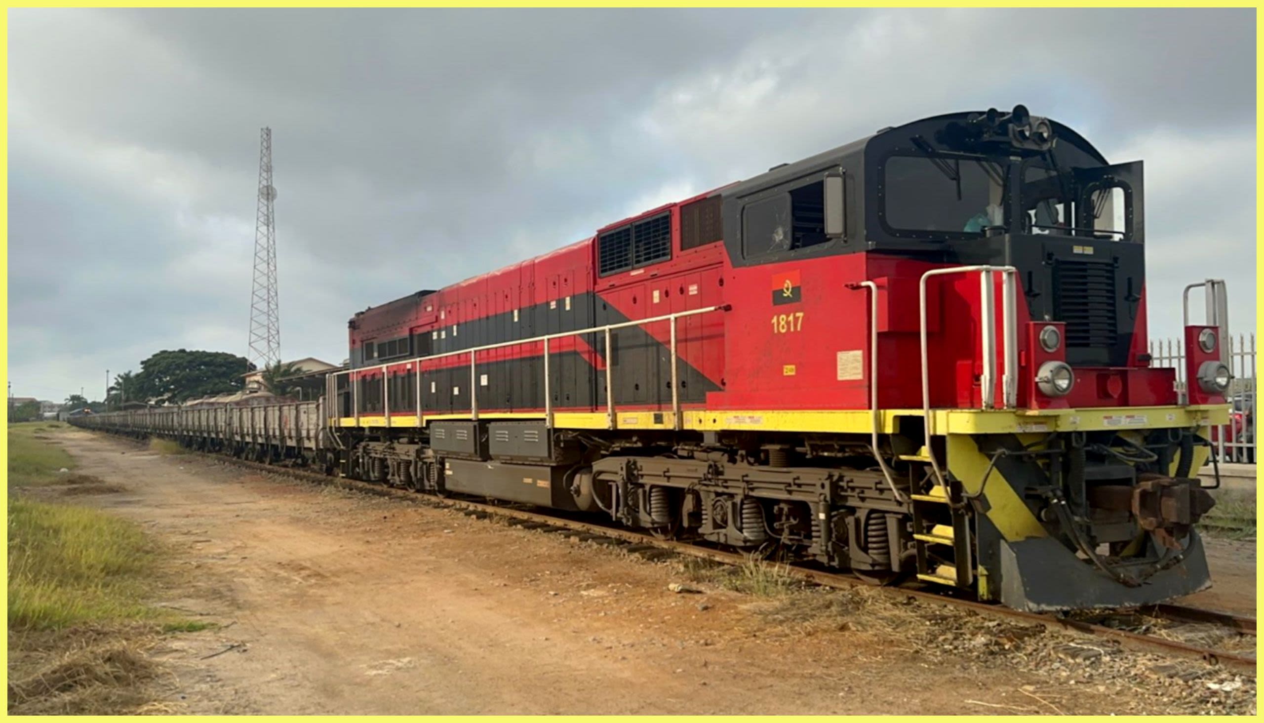 A red and yellow train sitting on the tracks at a station (Courtesy of Lobito Atlantic Railway)