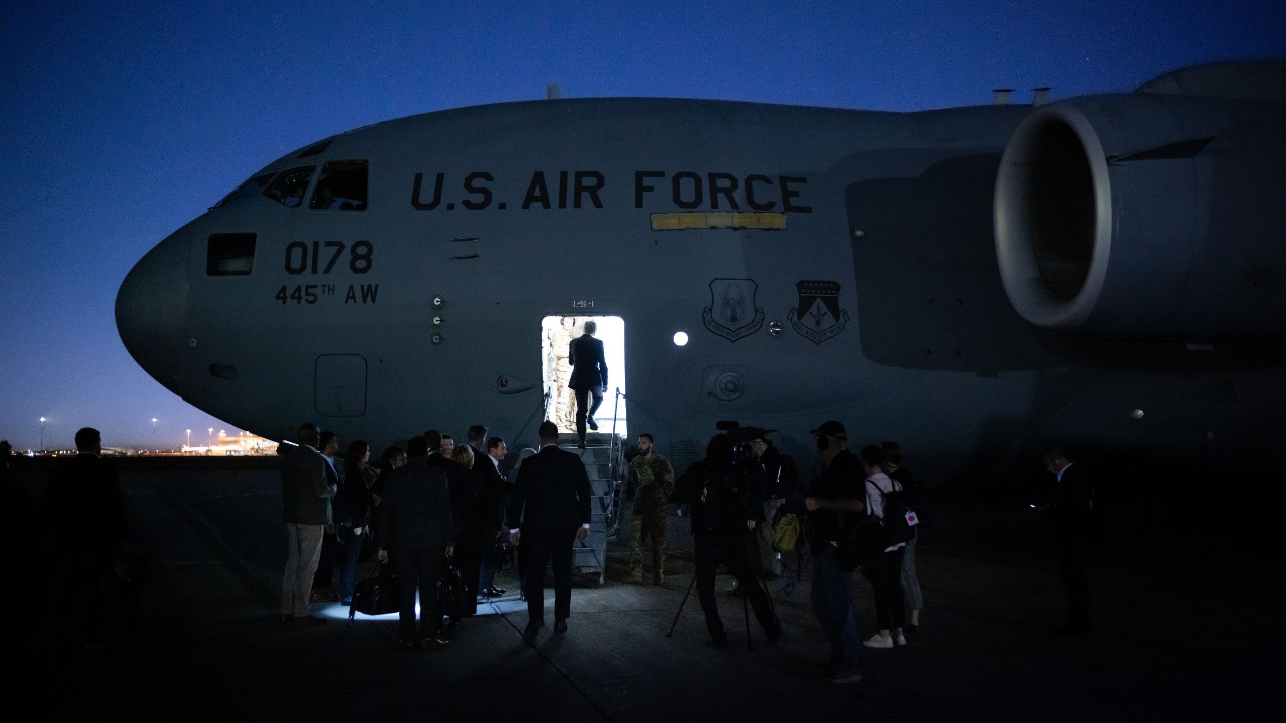 Secretary Blinken boarding a military aircraft