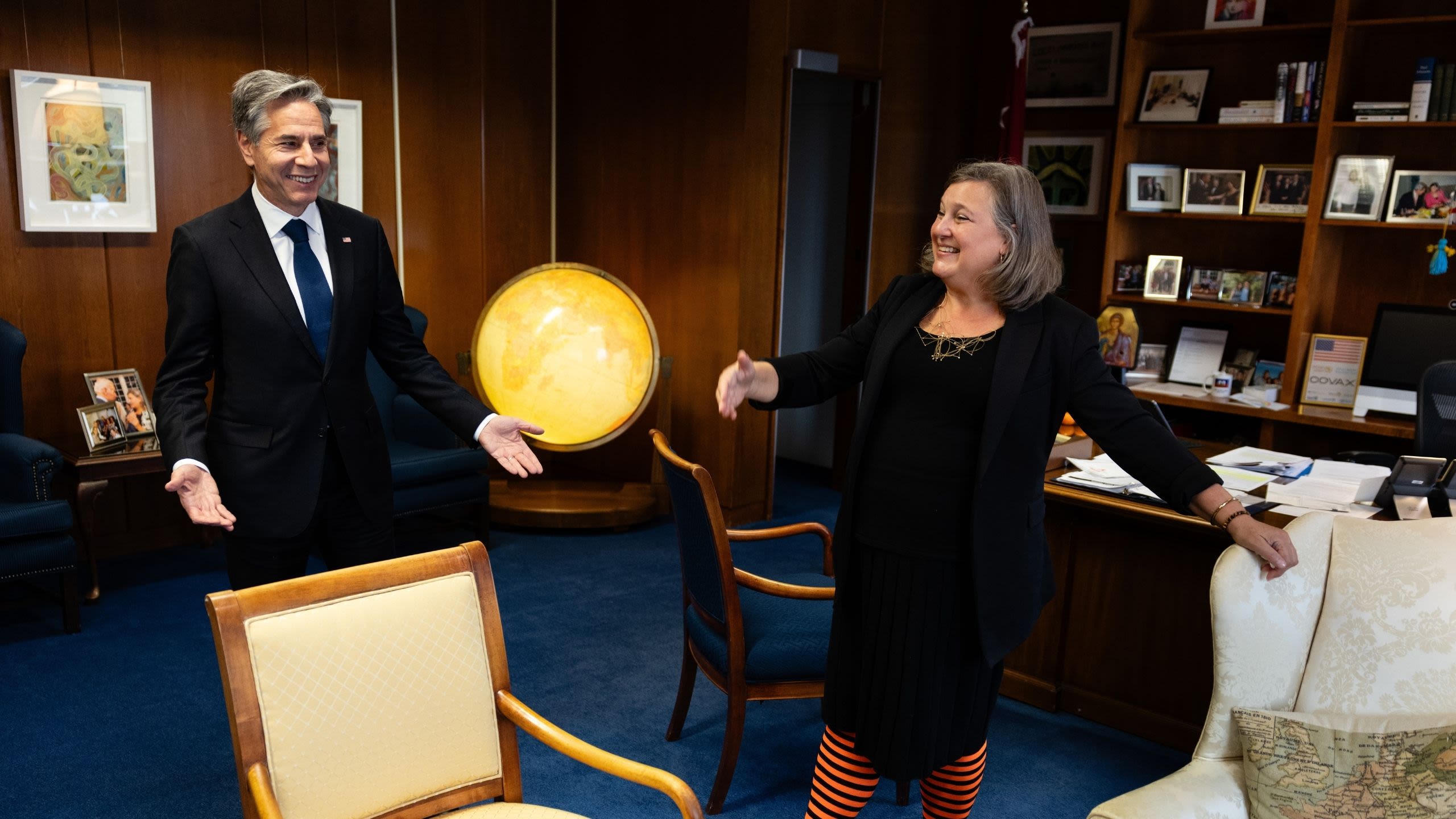 Secretary Blinken talking with Victoria Nuland in an office