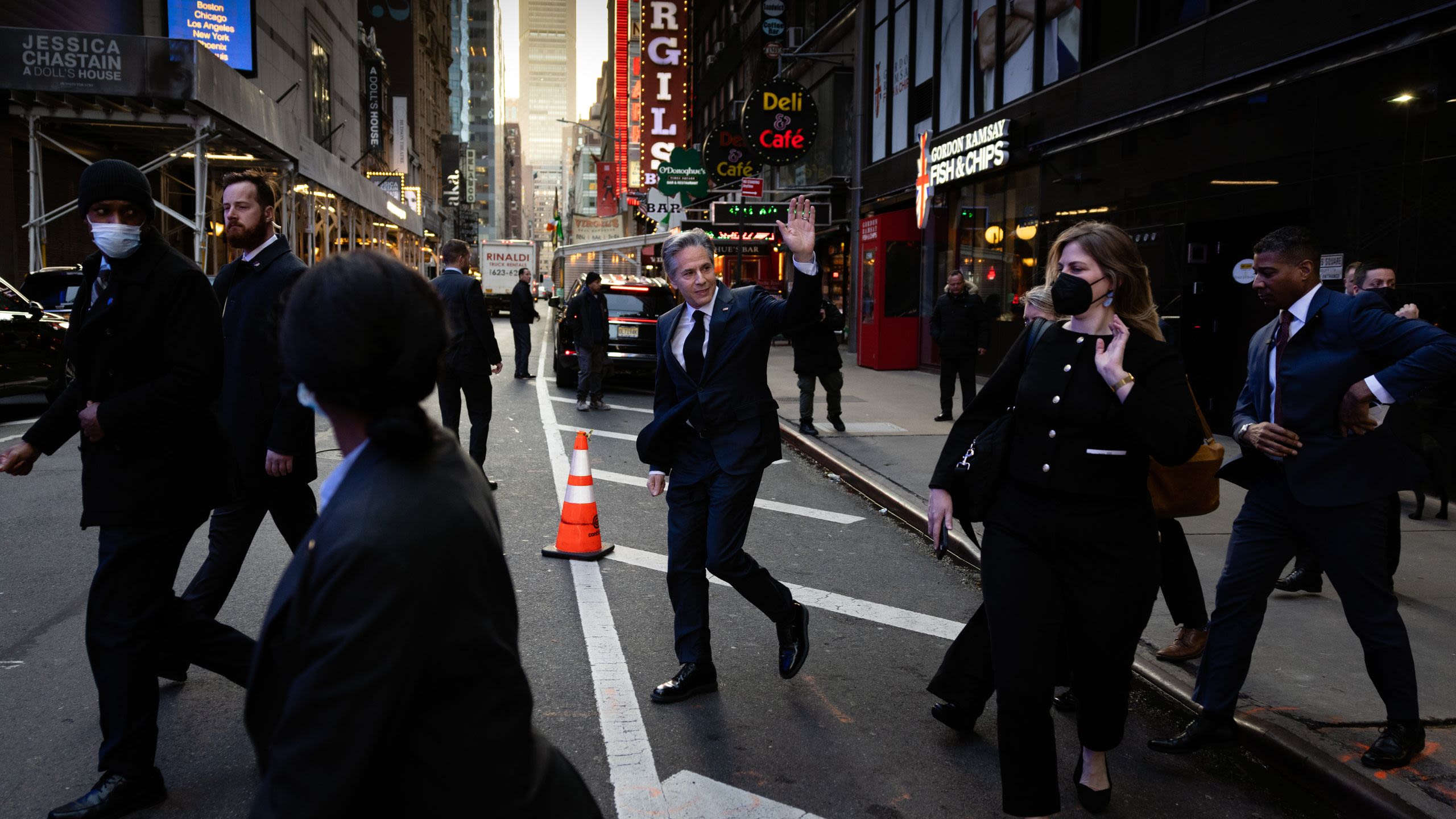 Secretary Blinken walking in the streets of New York City with a group of people surrounding him
