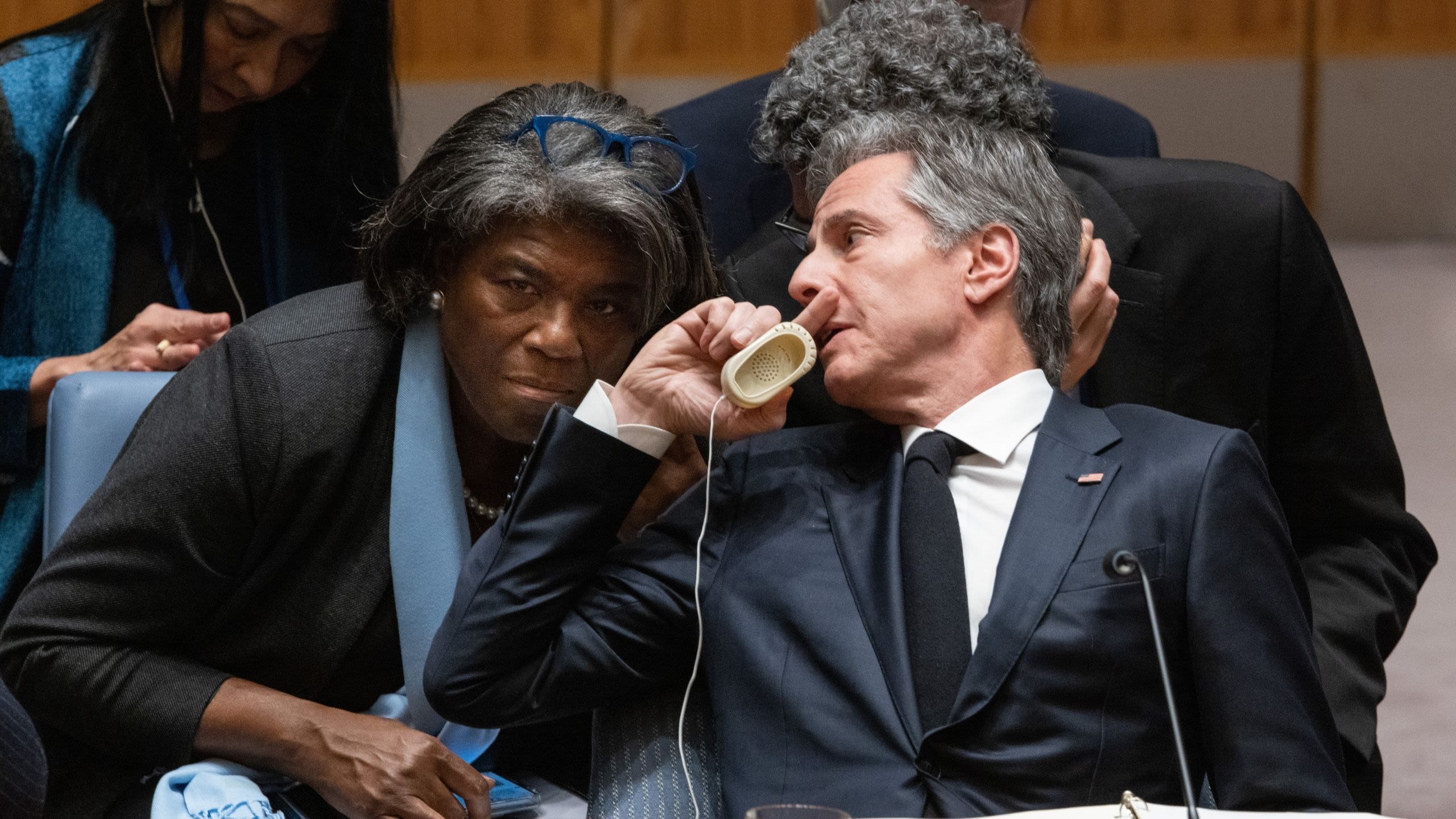 Secretary Blinken leaning back in chair to talk to Linda Thomas-Greenfield