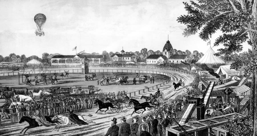 An 1884 illustration of the Iowa State Fair featuring horse races, livestock displays, machinery exhibits, and a hot air balloon (© Smith Archive/Alamy)