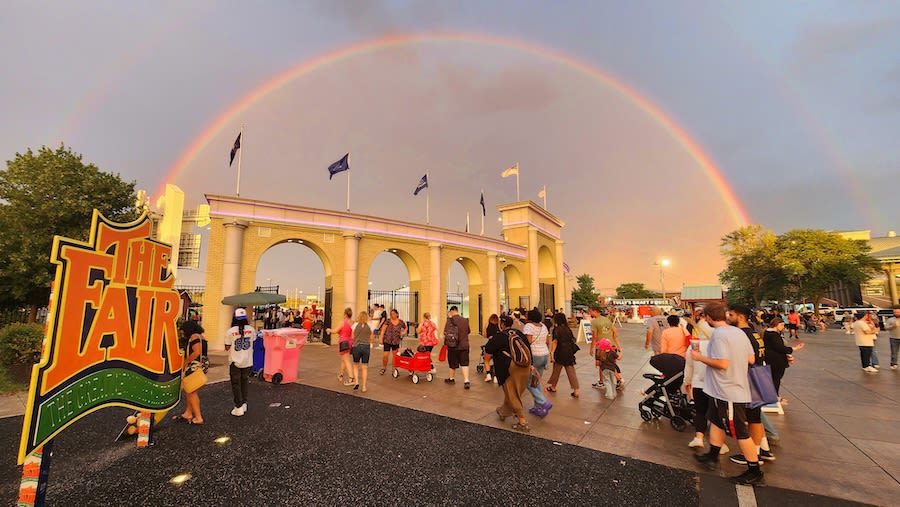 People enter the New York State Fair under a rainbow at the main gate. (Warren Linhart/New York State Fair)