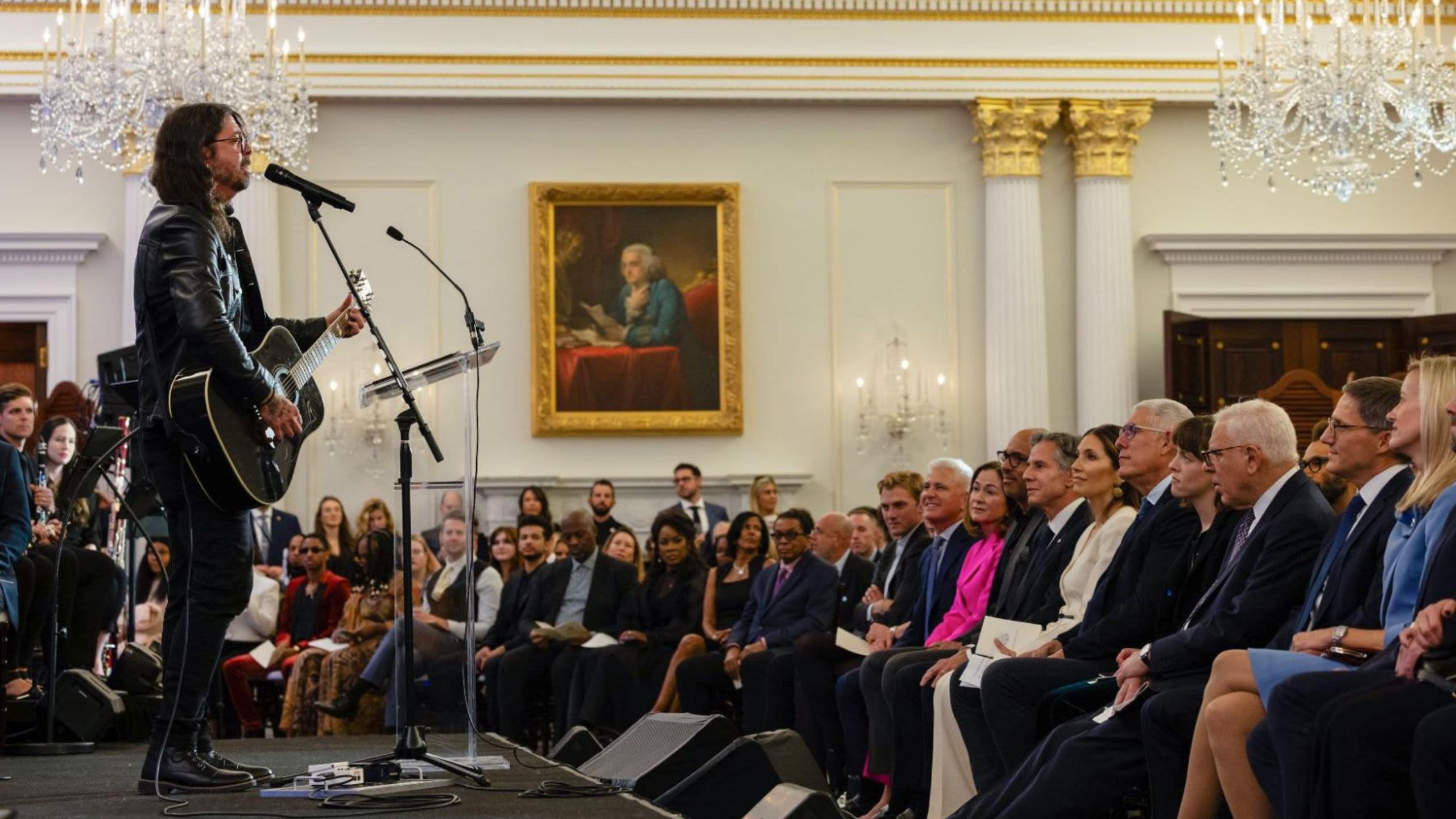 Man performing on stage in front of a crowd (State Dept./Chuck Kennedy)