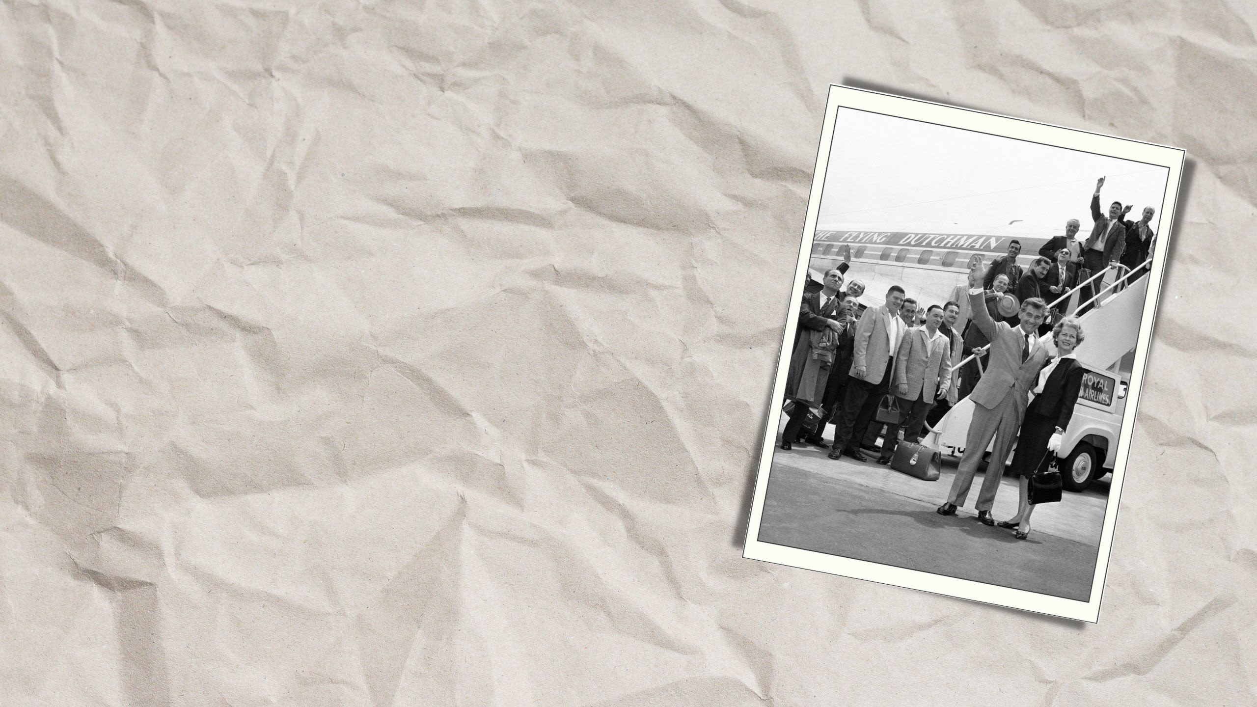 People waving as they board an airplane (© John Lindsay/AP)