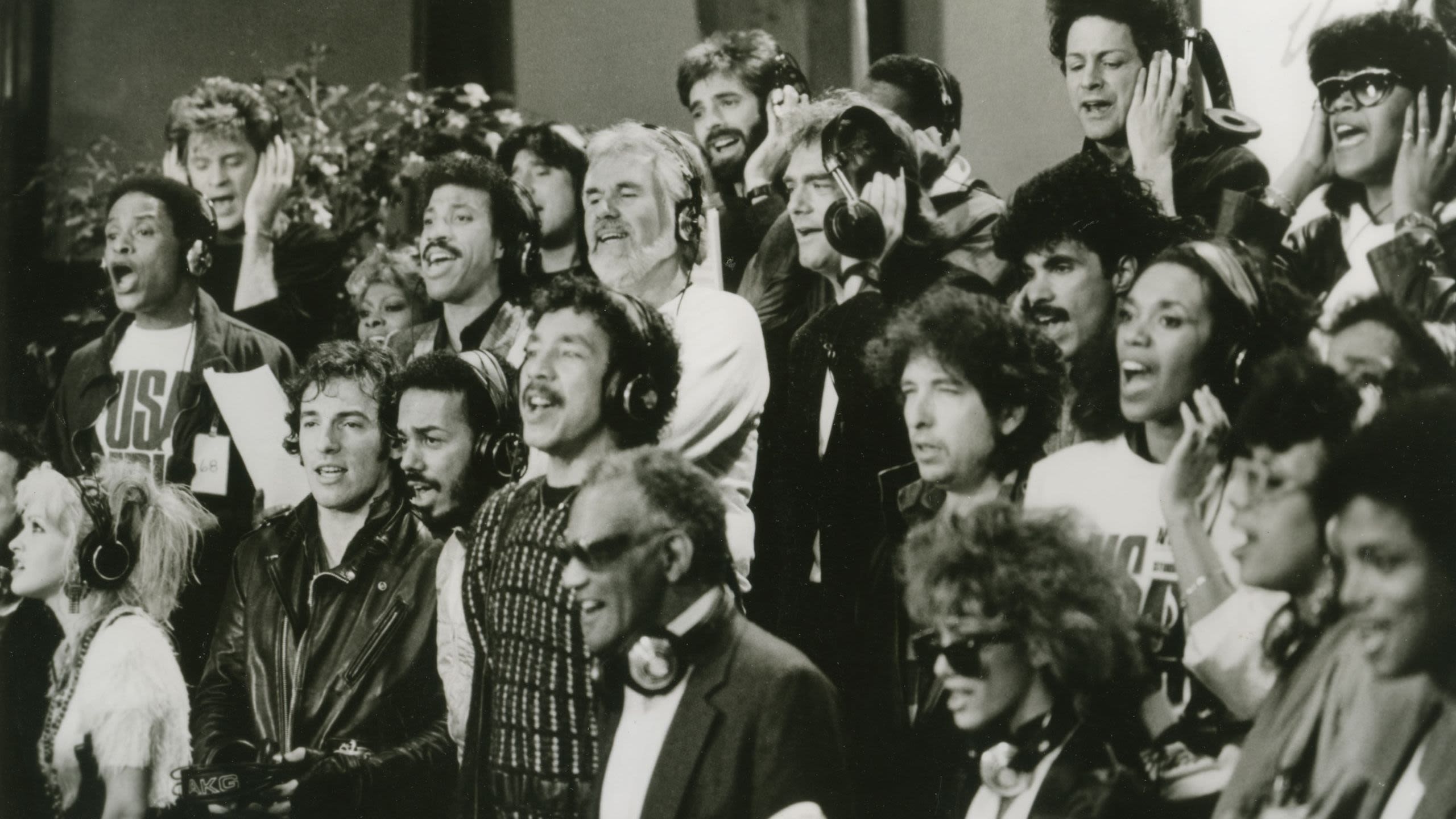 A group of famous musicians singing in a recording studio (© Pictorial Press Ltd/Alamy)