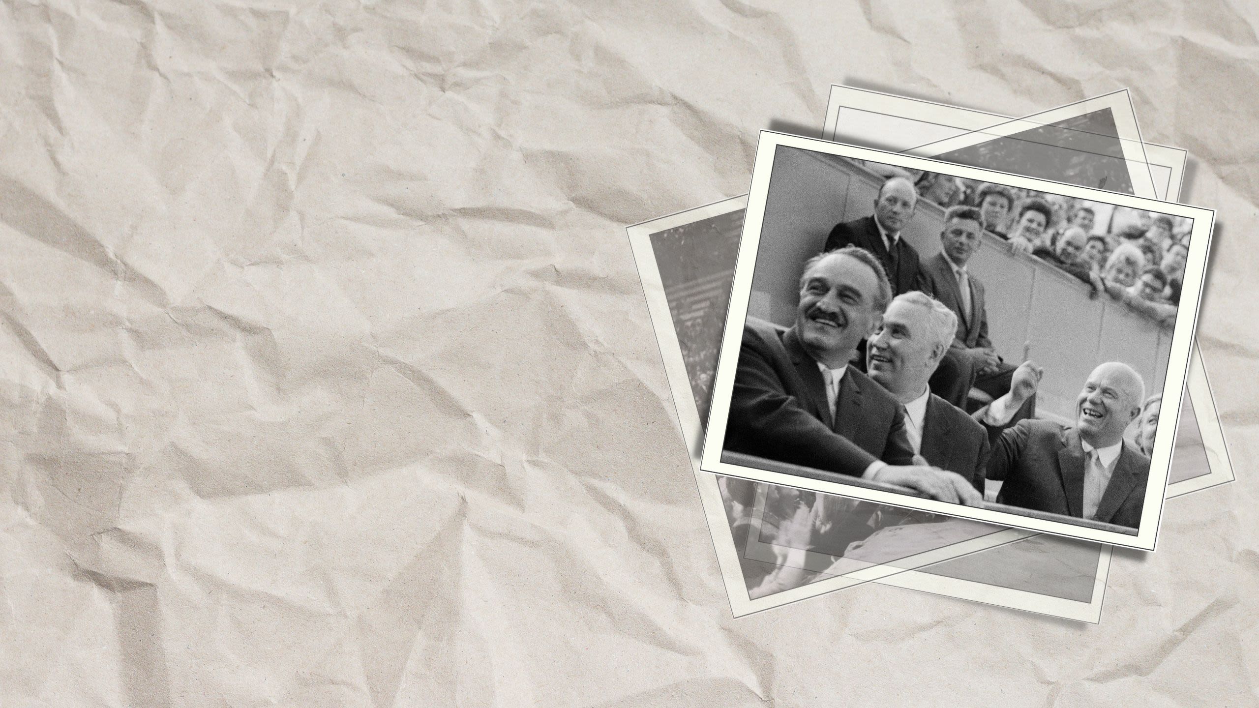 Soviet Premier Nikita Khrushchev sitting in an audience and smiling (© Bettmann/Getty Images)