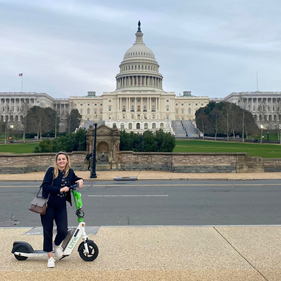 A woman posing for a photograph in front of the U.S. Capitol (Courtesy of Edith Delaney)