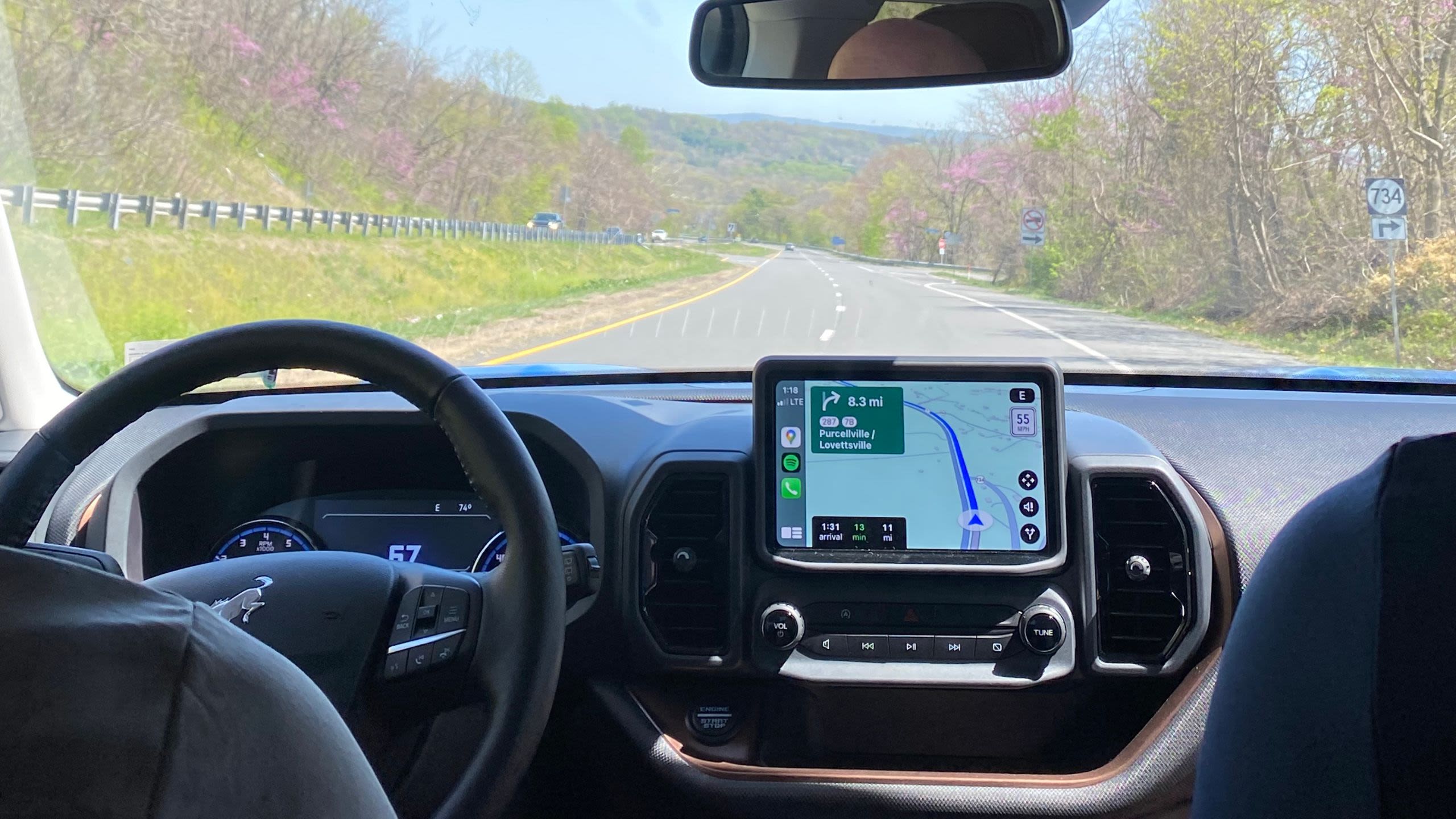 View of out of the inside of a car with a GPS unit and steering wheel visible (Courtesy of Rūta Beinoriūtė)
