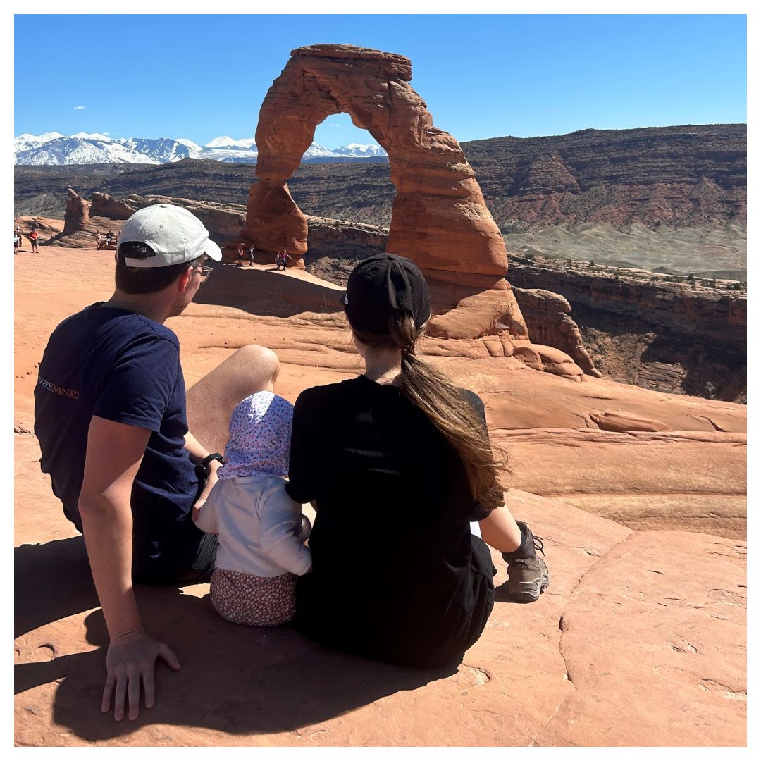 Man, woman, and child looking at an arch (Courtesy of Matúš Huťka)