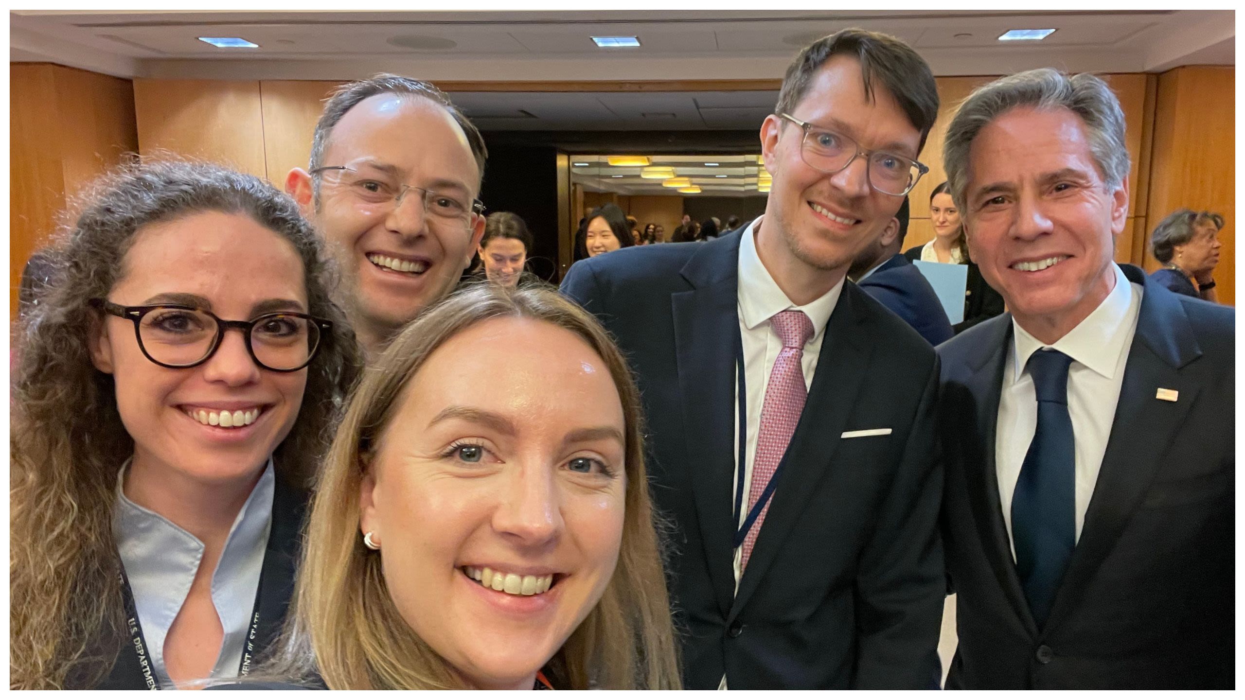 Smiling people posing for a selfie with Secretary of State Antony Blinken (Courtesy of Rūta Beinoriūtė)